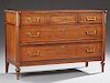 French Louis XVI Style Carved Cherry Commode, early 20th c., the rectangular ogee edge cookie corner top over three frieze dr