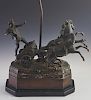 Patinated Spelter Figural Lamp, 20th c., with a charioteer and his horses, on a stepped wood and ebonized octagonal base, wit