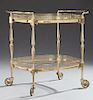 French Two Tier Brass and Glass Serving Cart, 20th c., with reticulated brass galleries around each glass shelf, the top with