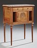 French Louis XVI Style Carved Walnut Marble Top Nightstand, 19th c., the rounded inset highly figured crЉme marble over doub