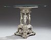 Bronze Center Table, 20th c., the thick beveled edge round glass top on an urn form base supported by the three graces, on a 