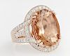 Lady's 14K Rose Gold Dinner Ring, with a 10.14 carats cabochon oval Ethiopian opal atop a border of round diamonds, the shoul