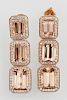 Pair of 14K Yellow Gold Pendant Morganite Earrings, each with a screwpost stud with an emerald cut morganite atop a frame of 