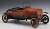 Structo Pressed Steel Windup Toy Roadster, c. 1920, in orange, the radiator with a pressed "Structo" name plate, with much or