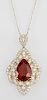 14K Yellow Gold Pendant, with a pear shaped 11.98 carats ruby, within a pierced floriform diamond mounted bezel, with a diamo