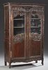 French Louis XV Style Carved Oak Armoire, c. 1860, Brittany, the stepped crown over a central relief carved flowering urn, ab