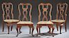 Set of Four English Carved Oak Queen Anne Chairs, 20th c., the arched curved crest rail over a pierced vertical splat to wide