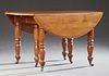 Louis Philippe Carved Cherry Drop Leaf Dining Table, 19th c., the circular top with a stepped rounded edge, on six turned and