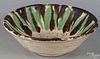 Continental redware bowl, 19th c., with brown and green splash glazing, 2'' h., 6 1/4'' dia.