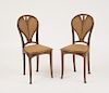PAIR OF ART NOUVEAU CARVED MAHOGANY SIDE CHAIRS, IN THE STYLE OF LOUIS MAJORELLE