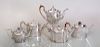 VICTORIAN SILVER TEAPOT, THREE SILVER PLATE TEAPOTS AND A COFFEE POT