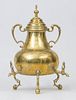 CONTINENTAL TRIPOD BRASS URN AND COVER WITH THREE SPOUTS