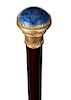 74. Lapis Dress Cane- Ca. 1880- 1 ¼” lapis stone is inlaid atop an ornate gilt mounting, probably Vienna but the hallmarks are unreadable, snakewood s