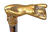 105. Erotic Defensive Cane- Ca. 1920- A bronze gold plated handle of a full front nude with her legs chained, matching collar ebonized shaft and a sta
