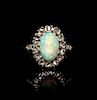 An Edwardian Platinum Topped Gold, Diamond and Opal Ring, 2.45 dwts.
