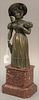 Bronze statue of a woman standing wearing a Victorian dress and sun hat, on granite base. bronze: height 12 inches, total height 17...