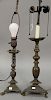 Two bronze table lamps, candlestick form having two sockets with triangular base and three paw feet. heights 24 inches and 23 inches.