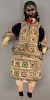 Asian doll of man with black hair, wearing robe made out of silver threading, 18th/19th century.  height 14 inches   Provenanc...