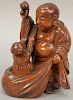 Carved Japanese figure of a Buddha and child, signed on bottom, having label inscribed with inventory number DR54 3232.  height 7...