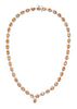 A 14 Karat White Gold, Orange Sapphire and Diamond Necklace, 25.50 dwts.