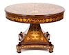 A Dutch Mahogany and Fruitwood Marquetry Center Table Height 31 1/2 x diameter 41 1/2 inches.