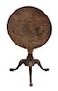 A George II Style Oak Miniature Tilt-Top Table Height 14 1/8 x diameter 12 inches.