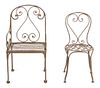 A Set of Ten Painted Wrought Iron Outdoor Dining Table and Chairs Height of chairs 32 inches.