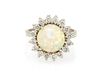 An 18 Karat White Gold, Opal and Diamond Ring, 3.30 dwts.