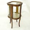 20th Century French Gilt and Floral Painted Vitrine with Brass Fittings. Two large curved fitted do