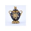 Neoclassical Style Gilt Brass and Painted Covered Urn with Bacchus Motif. Light rubbing to gilt ove
