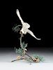 A LIMITED ISSUE BOEHM POLYCHROME ENAMELED  PORCELAIN AND COLD PAINTED BRONZE SCULPTURE,  "HOBBY  WITH PINE CONES, FALCO SUBBUTEO," NUMBERED 64024, 50/