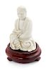 * A Chinese Blanc-de-Chine Porcelain Figure of a Luohan Height 4 inches.