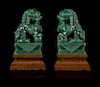 A Pair of Chinese Green Jade Figures of Fu Lions Height 6 1/4 inches.