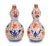 A Pair of Japanese Imari Porcelain Sake Bottles Height of each 6 inches.