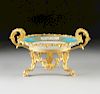 A SÃˆVRES STYLE GILT BRONZE MOUNTED AND POLYCHROME PAINTED TURQUOISE GROUND COMPOTE, ARTIST'S SIGNATURE R. PETIT, 19TH CENTURY,