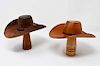 2 delicately made wooden cowboy hats