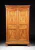 A FRENCH PROVINCIAL CARVED CHERRY ARMOIRE, EARLY 19TH CENTURY,