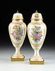 A PAIR OF SÃˆVRES STYLE PARCEL GILT AND COLORFULLY PAINTED VASES AND COVERS BY LIMOGES, 20TH CENTURY,