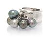 * An 18 Karat White Gold and Cultured Pearl Ring, 15.90 dwts.