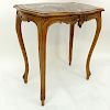 19/20th Century French Carved Wood Table with Marble Top. Carved apron with high cabriole legs.