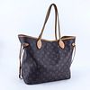Louis Vuitton Brown Monogram Coated Canvas And Leather Neverfull MM Handbag. Golden brass hardware, signature canvas interior with zippered pocket, va