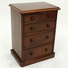 Antique English Miniature Chest of Drawers. Some losses to molding, wear to varnish, light scuffs otherwise good condition.