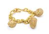An 18 Karat Yellow Gold Nautical Motif Charm Bracelet with Three Attached Charms, 82.70 dwts.
