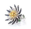 An 18 Karat Gold, Colored Diamond, Diamond, Sapphire and Tsavorite Flower Ring, 19.00 dwts.