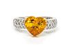 A Platinum, Yellow Gold, Yellow Sapphire and Diamond Ring, 4.40 dwts.