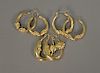 Three pairs of 14 karat gold earrings. 10.5 grams