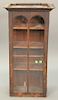 Hanging cabinet with arched door. ht. 33in., wd. 17 1/2in.