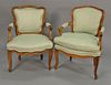 Near matching pair of Louis XV style armchairs, stamped: Made in France.