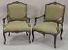 Three piece lot to include a pair of Louis XV style armchairs and a Louis XV style upholstered armchair.