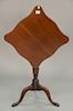 Colonial Williamsburg tip stand with shaped top. ht. 27 1/2in., top: 19 1/2" x 19 1/2"